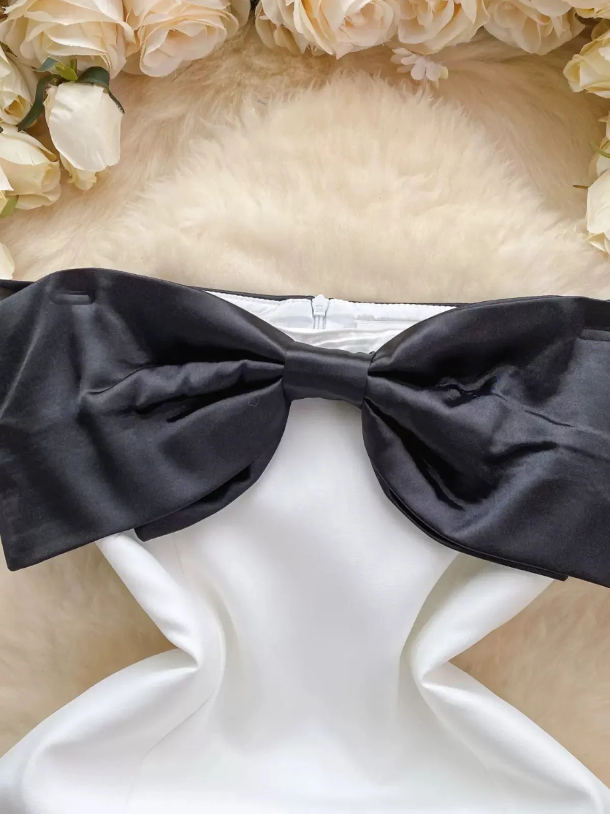 Elegant White Dress with Bold Black Bow