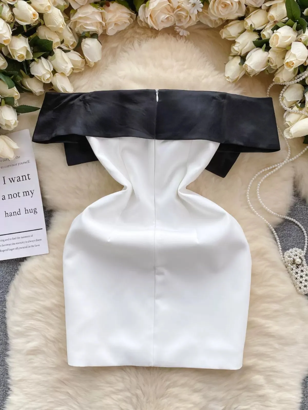Elegant White Dress with Bold Black Bow